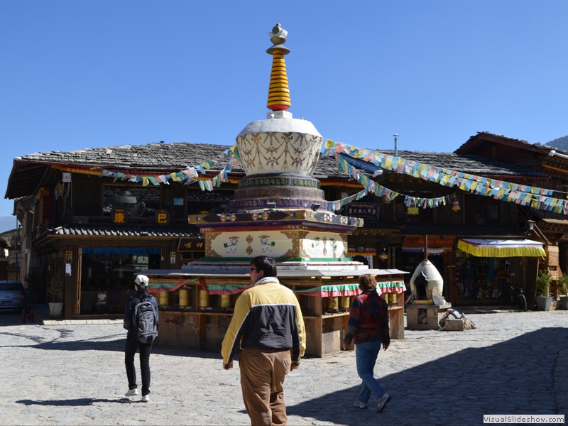 Note the prayer wheels along the sides of the monument.